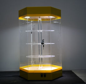 Китай Красивое ротатабельное акриловое основание желтого цвета шкафа выставочных витрин Локабле с светом приведенным поставщик